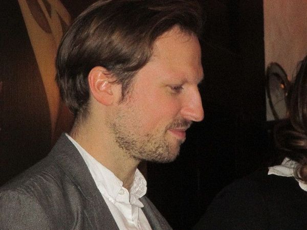 Virunga director Orlando von Einsiedel celebrating Leonardo DiCaprio as executive producer at the 21 Club in New York